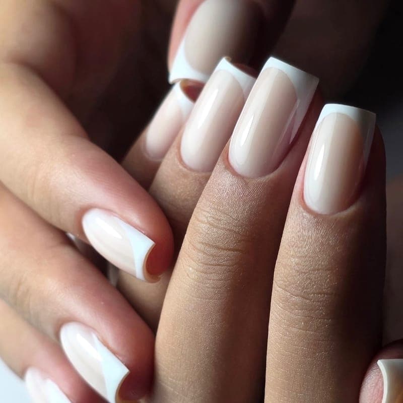 A long square French manicure with white tips