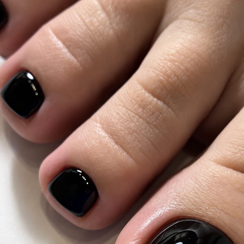 Toenails in a deep glossy black